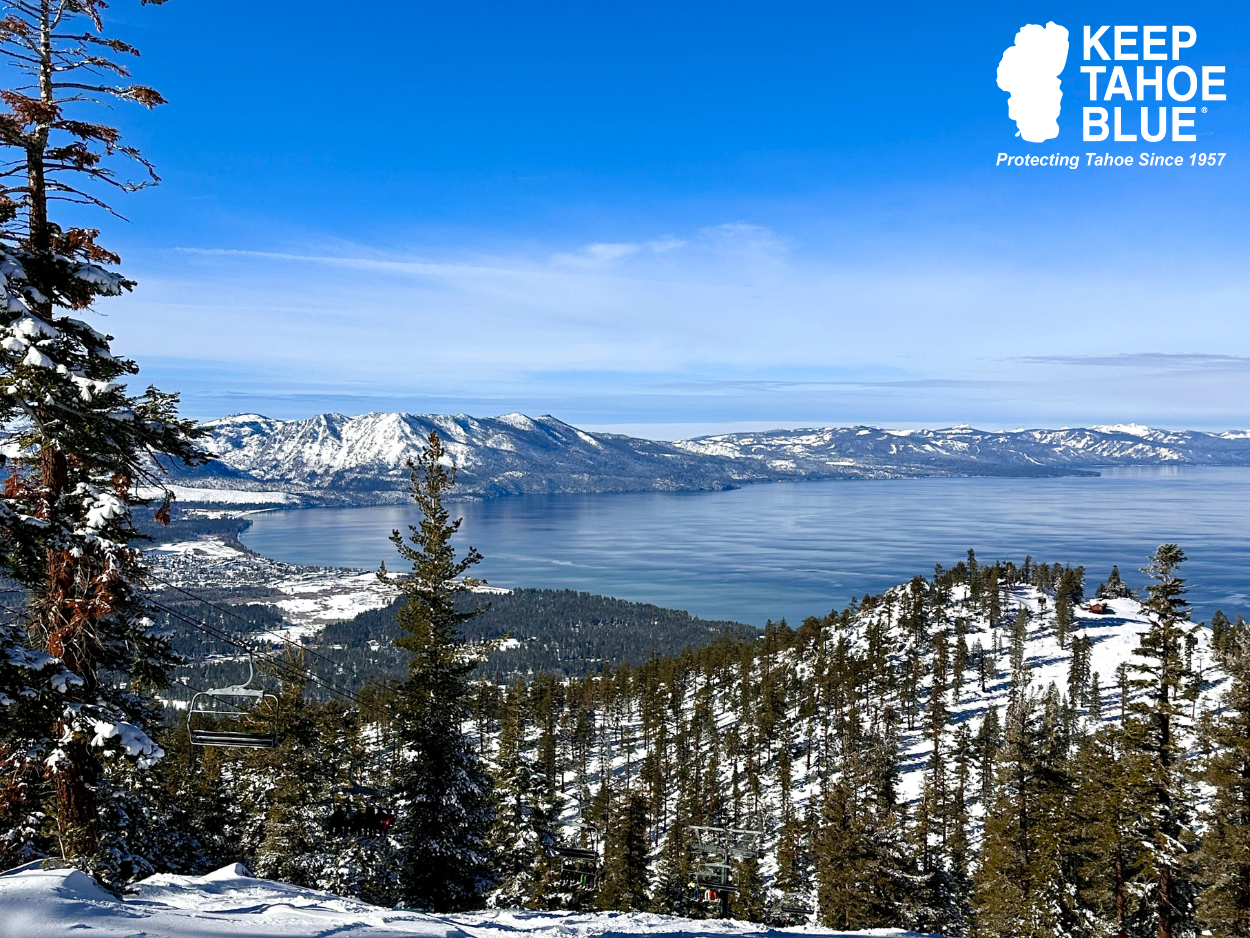 Scenic view of Lake Tahoe from Heavenly Resort showing the lake and a chair lift in the distance. 