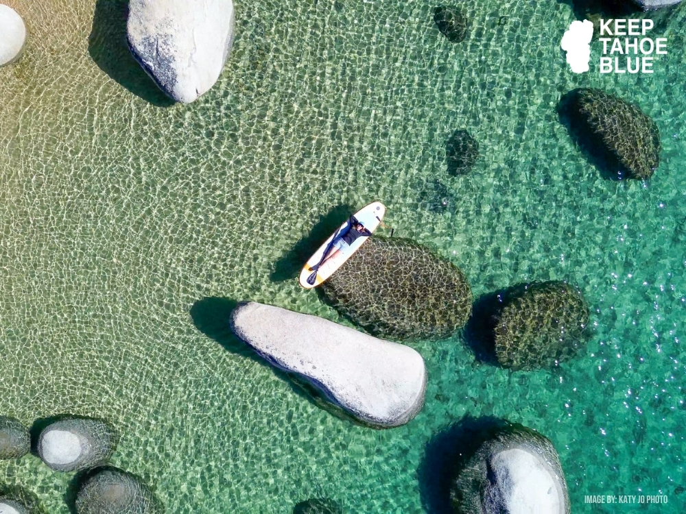 SUP paddler on Lake Tahoe's blue waters