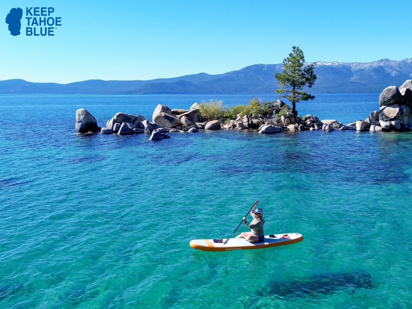 SUP paddler on Lake Tahoe's blue waters