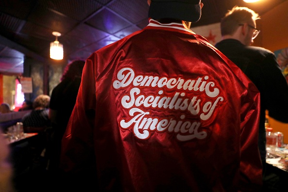 A supporter wears a Democratic Socialists of America jacket