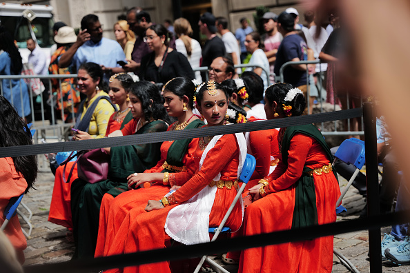 Indian-Americans participate in a flag-raising ceremony