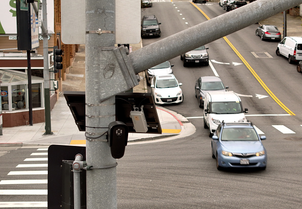 An automated license plate reader is seen mounted on a pole