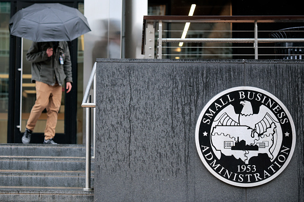 People walk past the headquarters of the U.S. Small Business Administration