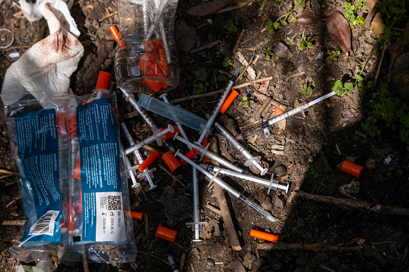 Dirty needles are collected by outreach workers