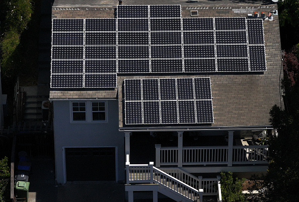 Solar panels are seen on the roof of a home