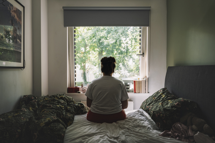 A young woman looking out the window