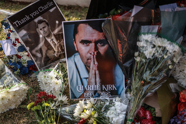 A wreath laid by mourners outside the US Embassy in Pretoria on September 11, 2025 following the fatal shooting of Charlie Kirk 