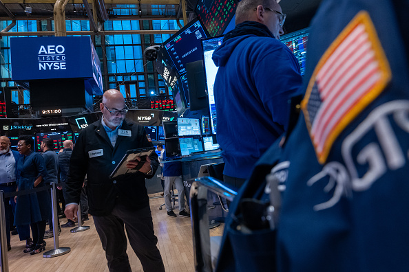Traders work on the floor of the New York Stock Exchange