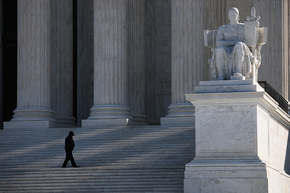 The Authority of Law statue by artist James Earle Fraser in front of the United States Supreme Court building
