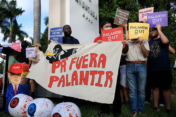 Activists protest outside new Palantir headquarters
