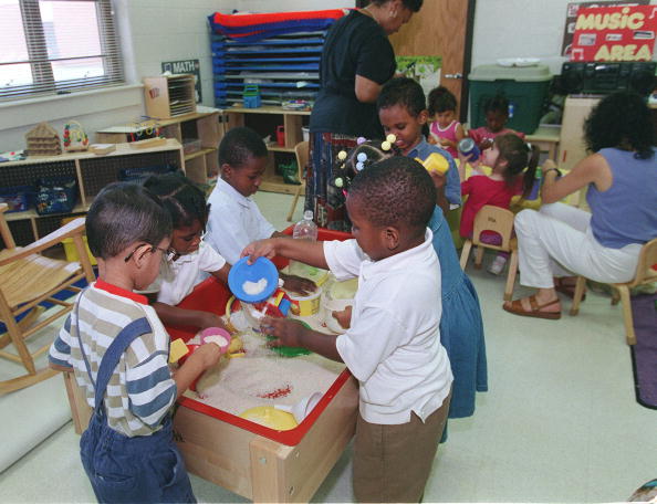 Preschoolers play with rice in Fairfax, Virginia Preschoolers play with rice in Fairfax, Virginia