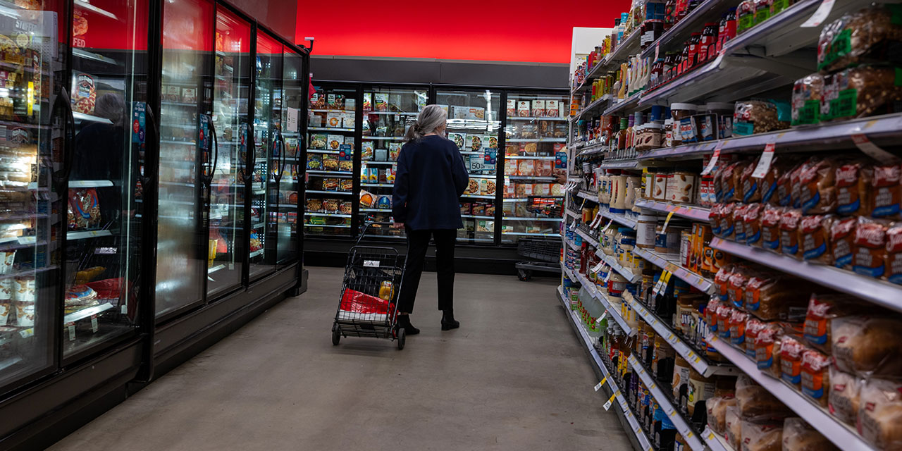 People shop at a grocery store in Manhattan on April 01, 2025.