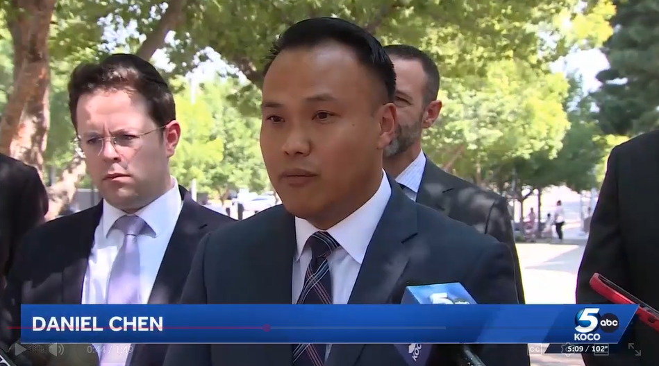 Daniel Chen speaking to the press