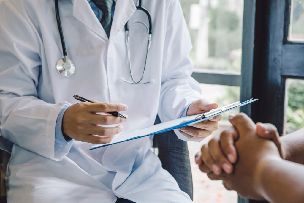 Doctor's hands holding clipboard