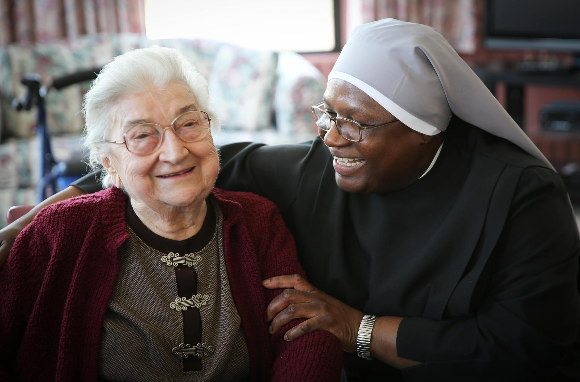 Little Sisters of the Poor nun with woman