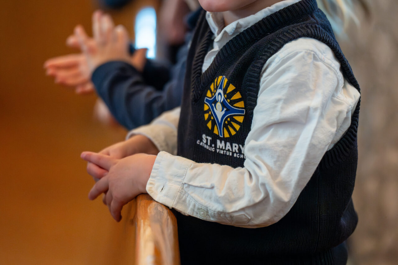 Child in Catholic school uniform